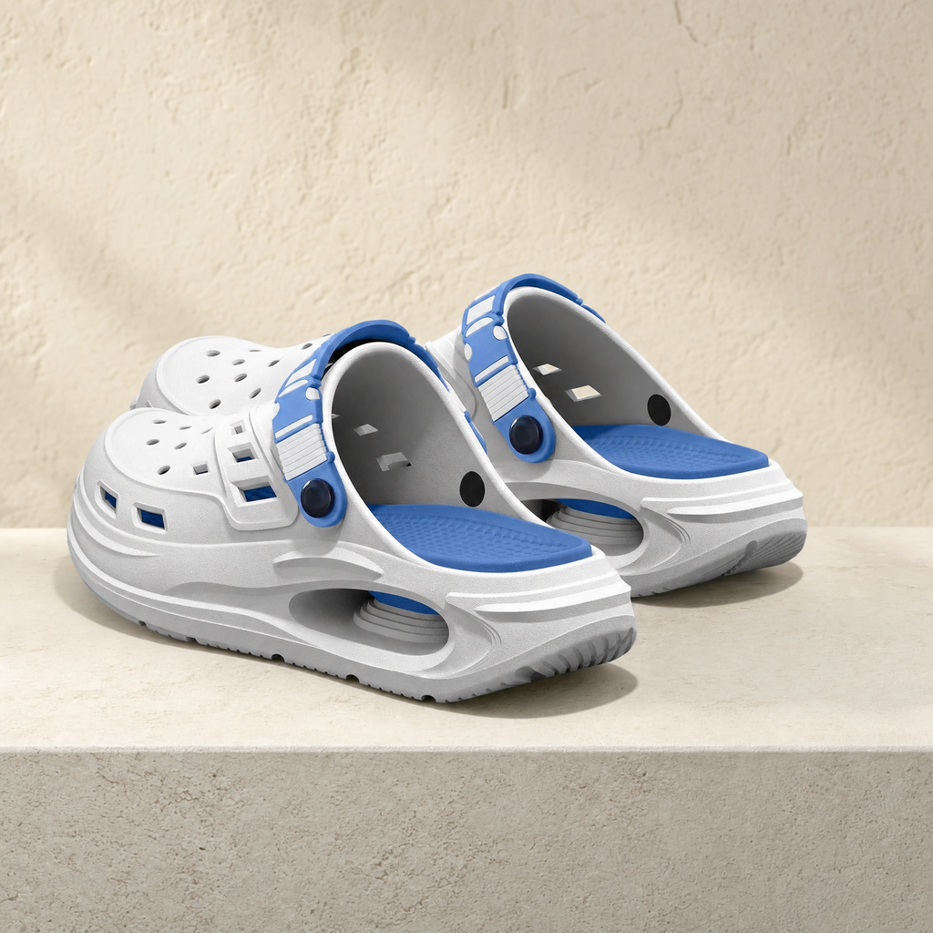 Arch support clog in white and blue on a stone ledge