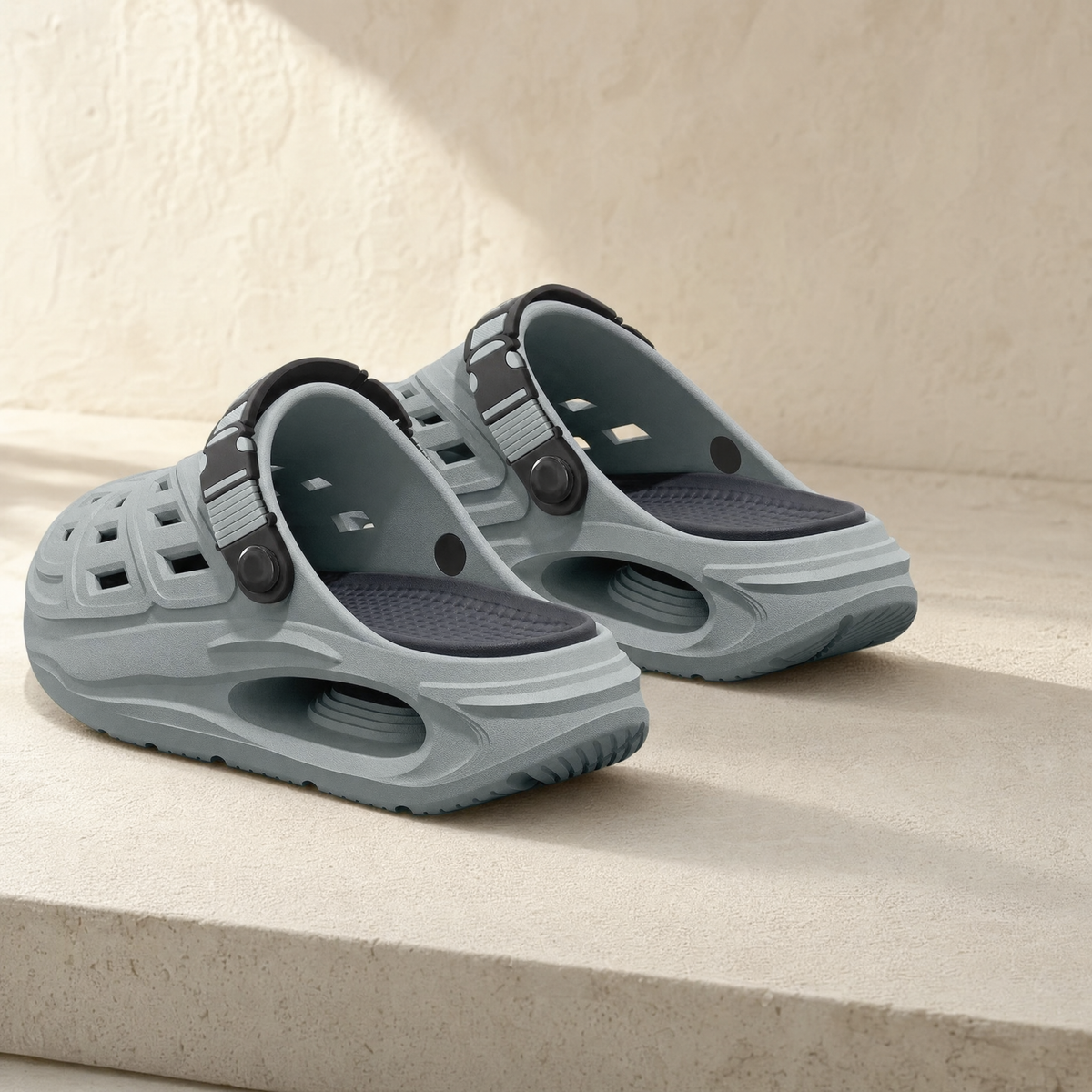 Arch support clog in grey on a stone ledge