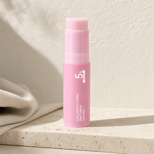 Retinol collagen plumping balm stick on a travertine ledge
